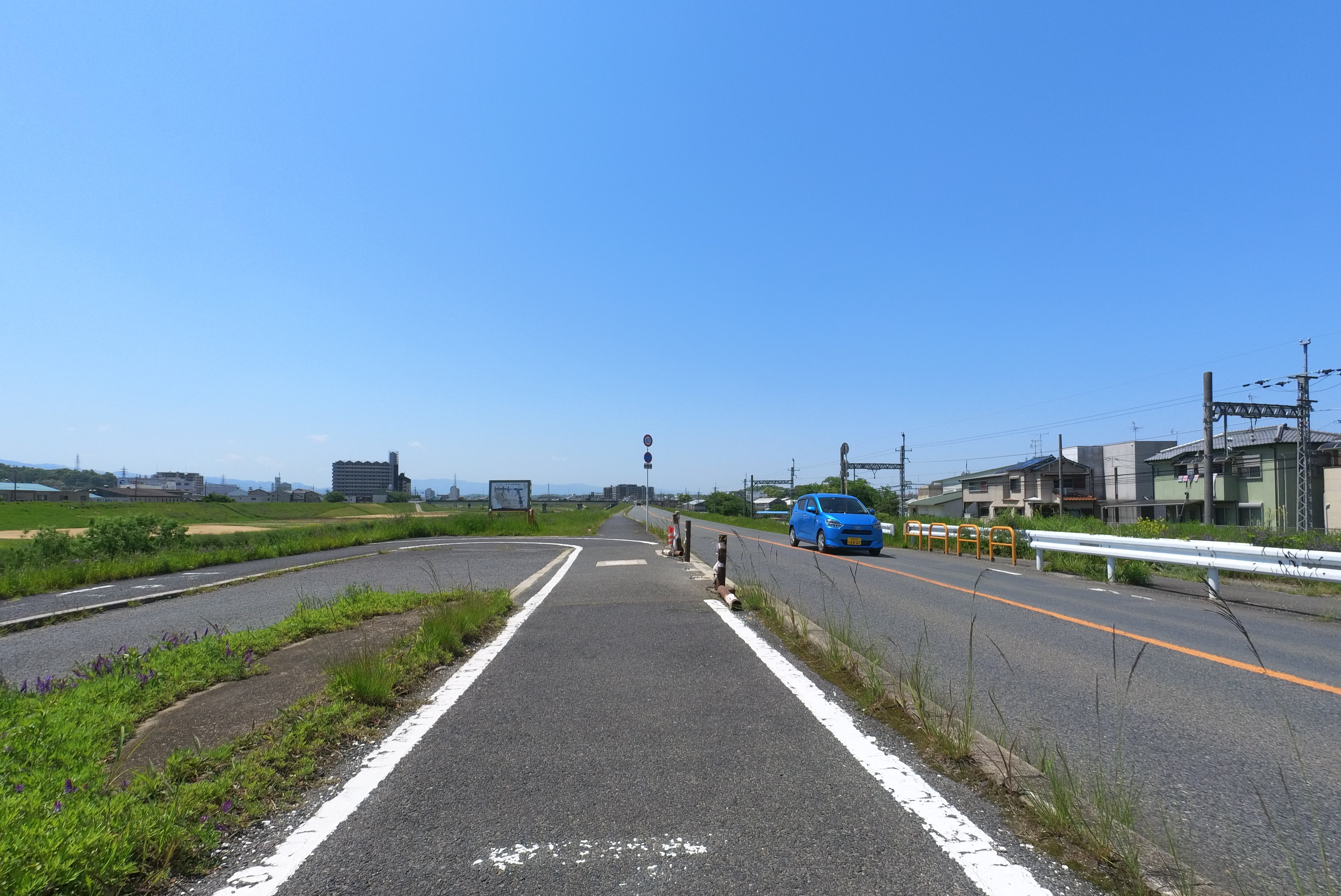 Road leading down to the riverbank